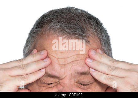 Mann mit Händen auf der Stirn Stockfoto