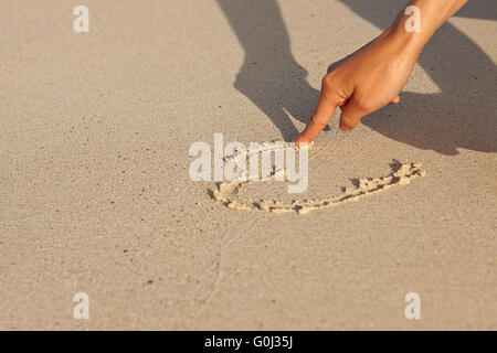 Handschrift in Sand im Sommerurlaub am Strand Stockfoto