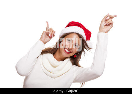 Young woman in a Santa hat holding out her hands Stockfoto