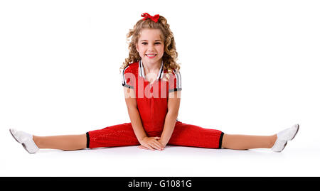 Kleine Mädchen-Tänzerin in verschiedenen Kostümen, isoliert auf weiss. Stockfoto