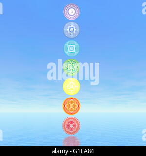 Sieben Chakra-Symbole-Spalte in blauem Hintergrund - 3D render Stockfoto