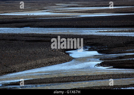 Glazial-Abfluß durchdringen die vulkanischen Sand schlichte Skeidararsandur, Region Süd, Island Stockfoto