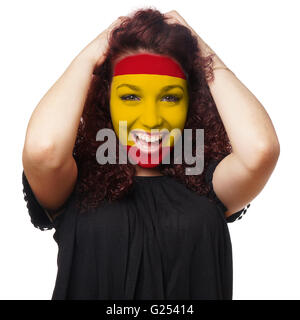 Mädchen mit spanischer Flagge Gesicht malen Stockfoto