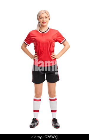 In voller Länge Portrait von weiblichen Fußballprofi in ein rotes Trikot isoliert auf weißem Hintergrund Stockfoto