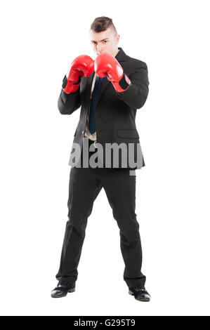 Kraftvoll und entschlossen Geschäftsmann tragen rote Boxhandschuhe und zum Schutz seiner privaten Unternehmen Stockfoto
