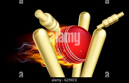 Ein flammender Cricketball am Feuer schlagen Wicket Stümpfe Stockfoto