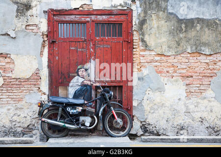 GEORGE TOWN, MALAYSIA - März 22: "Junge auf dem Motorrad" Straße Installation von Ernest Zacharevic auf 22. März 2016 in George Tow Stockfoto