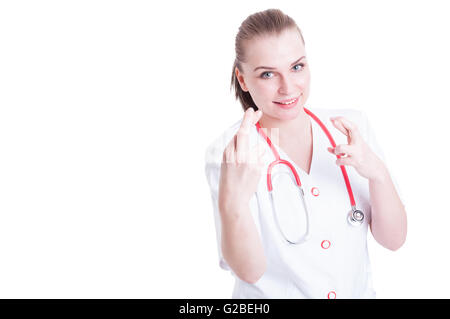 Ärztin die Daumen ihr auf einem weißen Hintergrund als Supertition und Glück Konzept mit Exemplar Stockfoto