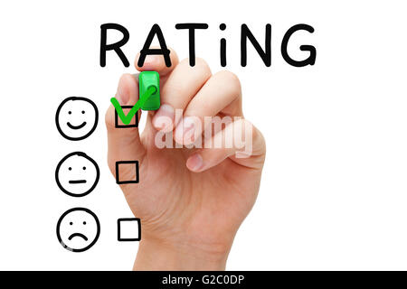 Hand, Häkchen mit grüne Markierung auf hervorragende Bewertung. Kunden-Zufriedenheit-Konzept. Stockfoto