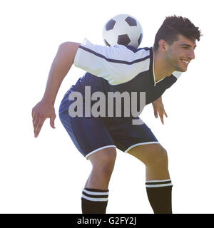 Man Fußball-Spieler den Ball auf seinem Rücken Stockfoto