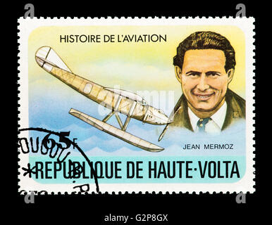 Briefmarke aus Burkina Faso (Obervolta) Darstellung Jean Mermoz und frühen Wasserflugzeug. Stockfoto