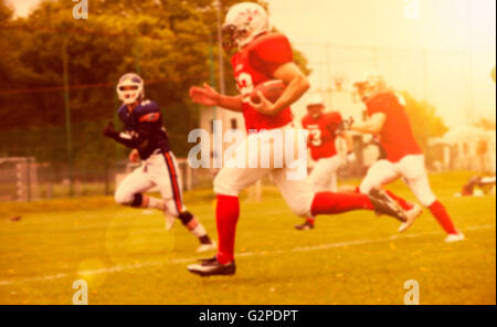 Unscharfen Hintergrund des american-Football-Spiel-Aktion Stockfoto