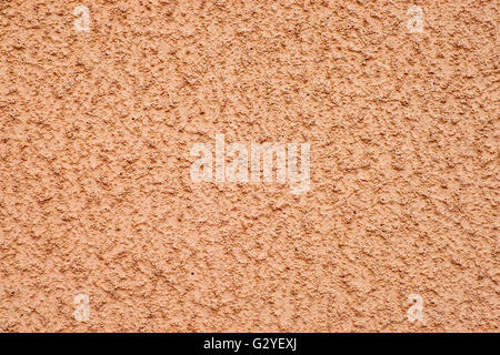 Beige strukturierten rauen Steinwand für Hintergrund Stockfoto