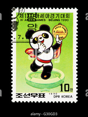 Briefmarke aus Nordkorea zeigt das Maskottchen von 1990-Sommer-Olympiade in Peking. Stockfoto