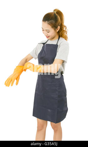 Asiatische Frau trägt Gummihandschuhe. Stockfoto