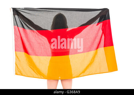 Athlet posiert mit deutscher Flagge nach Sieg Stockfoto