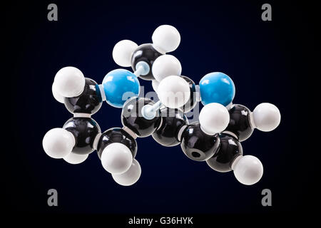 Nikotin-chemische Molekülstruktur-Modell über einen dunklen Hintergrund Stockfoto