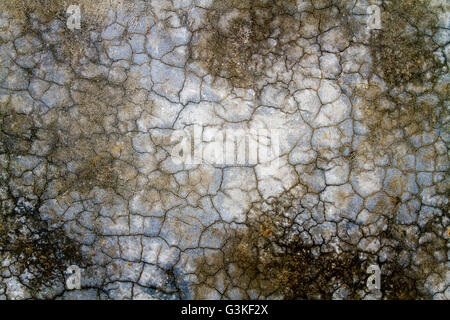 Einzigartige Textur oder Hintergründe der rissige Wand zementiert. Stockfoto