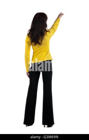 Junge Frau Punkte an Wand. Stockfoto