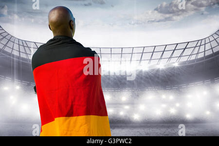 Zusammengesetztes Bild von Mann mit deutscher Flagge Stockfoto