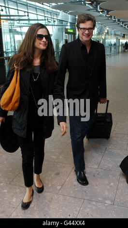 Colin Firth und seine Frau Livia Giuggioli kommen nach seinem Oscar-Triumph am Sonntag aus Los Angeles am Terminal 5 des Flughafens Heathrow an. Stockfoto