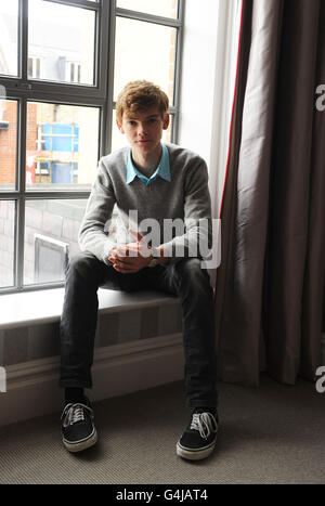 Phineas und Ferb. Thomas Sangster, der die Stimme von Ferb in Disney's Phineas und Ferb spielt, im Soho Hotel in London. Stockfoto