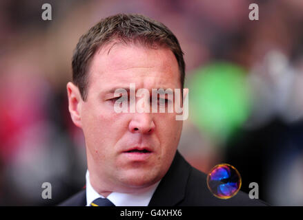 Fußball - npower Football League Championship - Playoff - Halbfinale - zweite Etappe - West Ham United gegen Cardiff City - Upton Park. Der Manager von Cardiff City, Malky Mackay, blickt auf eine Niederlage Stockfoto