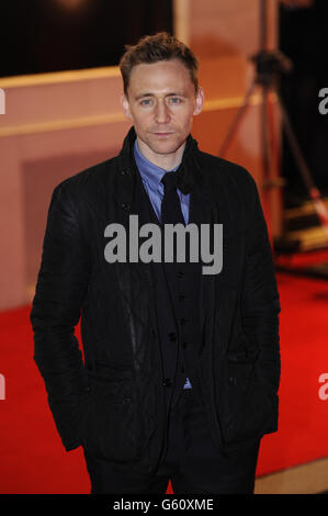Tom Hiddleston kommt zur Eröffnungsnacht des Buches Mormon im Prince of Wales Theatre, London. Stockfoto