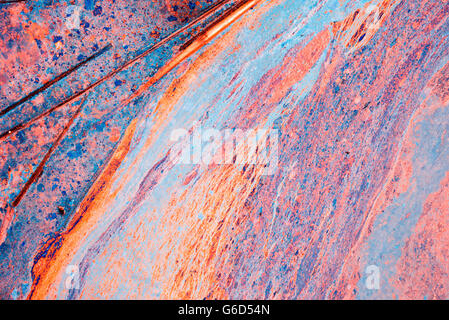 Bunte Flüssigkeit malen Hintergrund in kontrastreichen Farben des Regenbogens, abstrakte Textur Kunst Hintergrund. Stockfoto