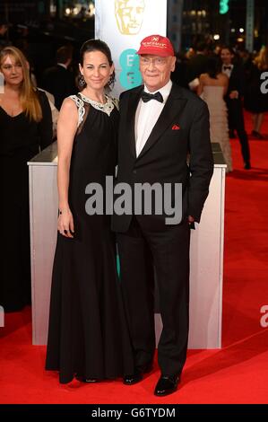 Niki Lauda und Birgit Wetzinger bei den EE British Academy Film Awards 2014 im Royal Opera House, Bow Street, London. Stockfoto