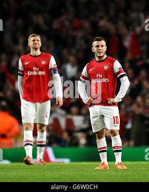 Arsenals Jack Wilshere (rechts) und per Mertesacker stehen dejeziert Stockfoto