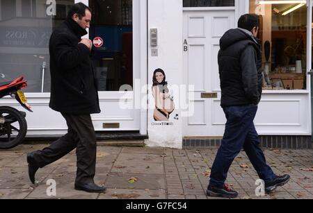 Graffiti, das eine Schwangeren Herzogin von Cambridge von den Künstlern Pegasus darstellt, ist an einer Wand an der Caledonian Road im Norden Londons zu sehen. Stockfoto