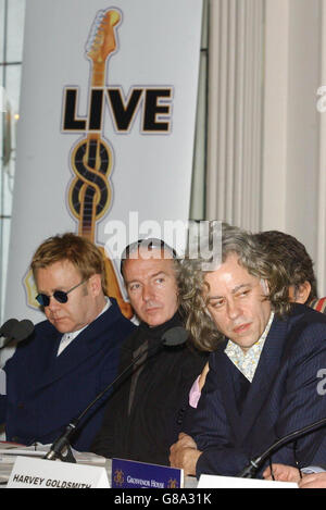 (Von links nach rechts) Sir Elton John, Midge Ure und Sir Bob Geldof. Stockfoto