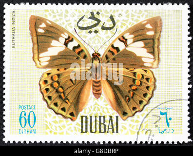 Grootebroek, Niederlande - März 8,2016: eine Briefmarke von Dubai gedruckt, zeigt tropischer Schmetterling, ca. 1968 Stockfoto