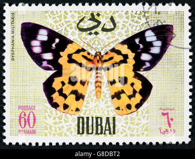 GROOTEBROEK, Niederlande - März 8,2016: eine Briefmarke gedruckt von Dubai, zeigt tropischer Schmetterling, ca. 1968 Stockfoto