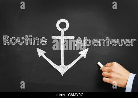 Handschrift der deutschen Wörtern "Routine" (Routine' und 'Abenteuer' (Abenteuer) eine Tafel Stockfoto