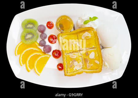 Honig-Toast mit gemischten Früchten und Eis Stockfoto