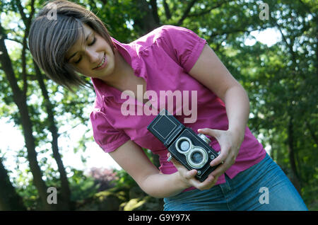 Junge Frau fotografieren Stockfoto