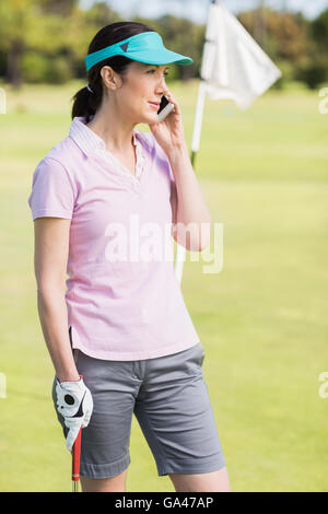 Golfer Frau am Telefon Stockfoto