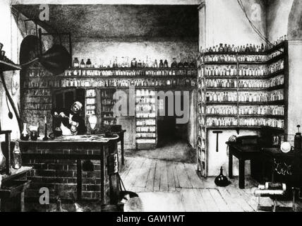 Michael Faraday (1791-1867). Englischer Physiker und Chemiker. Faraday in seinem Labor. Gravur. Stockfoto