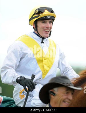 Pferderennen - John Smith's Northumberland Plate Day - Newcastle Racecourse. Arc Bleu Jockey Adrian Nicholls lächelt, nachdem er die Northumberland Plate von John Smith auf der Rennbahn von Newcastle gewonnen hat. Stockfoto