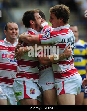 Wigans Phillip Bailey feiert seinen Versuch mit Sean O'Loughlin (rechts) während des Carnegie Challenge Cup Halbfinalmatches im Stobart Stadium, Widnes. Stockfoto