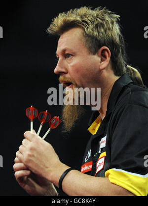 Australiens Simon Whitlock während der World Darts Championship Ladbrokes.com im Alexandra Palace, London. Stockfoto