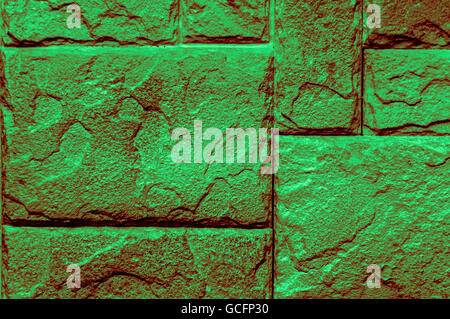 dunkel grün rötlich grünlich Leuchtstein Wand Closeup Hintergrund Bildschirmschoner Stockfoto