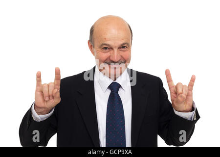 Amateur Rock-Musik bei einem Geschäftstreffen. beleben Sie alte. Älterer Mann in einem Anzug zeigt ein Zeichen der Hörner Stockfoto