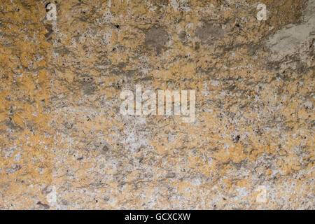 Orange und weiß bemalt Felswand Hintergrundbild Stockfoto