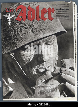 Ereignisse, 2. Weltkrieg, Propaganda, Titelseite der Zeitschrift 'der Adler', Sonderheft, 1.8.1944, schlammiger deutscher Fallschirmjäger, der eine Zigarette anzündet, Zusatzrechte-Clearences-nicht vorhanden Stockfoto