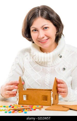 Porträt der jungen Frau ein Lebkuchenhaus Dekoration Stockfoto