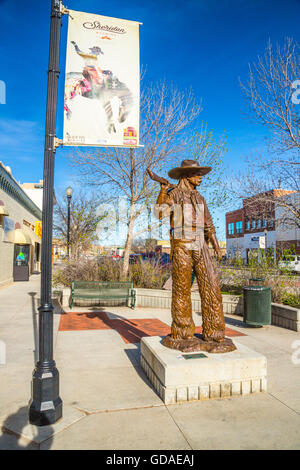 Sheridan USA Cowboy Statue Stetson Gewehr Schatten Stockfoto