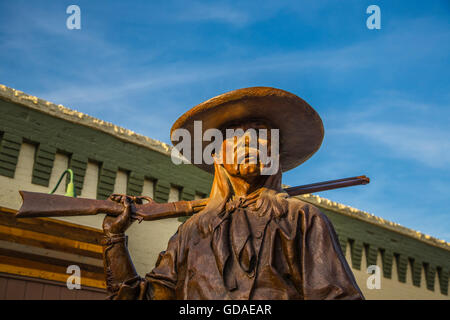 Sheridan USA Cowboy Statue Stetson Gewehr Schatten Stockfoto